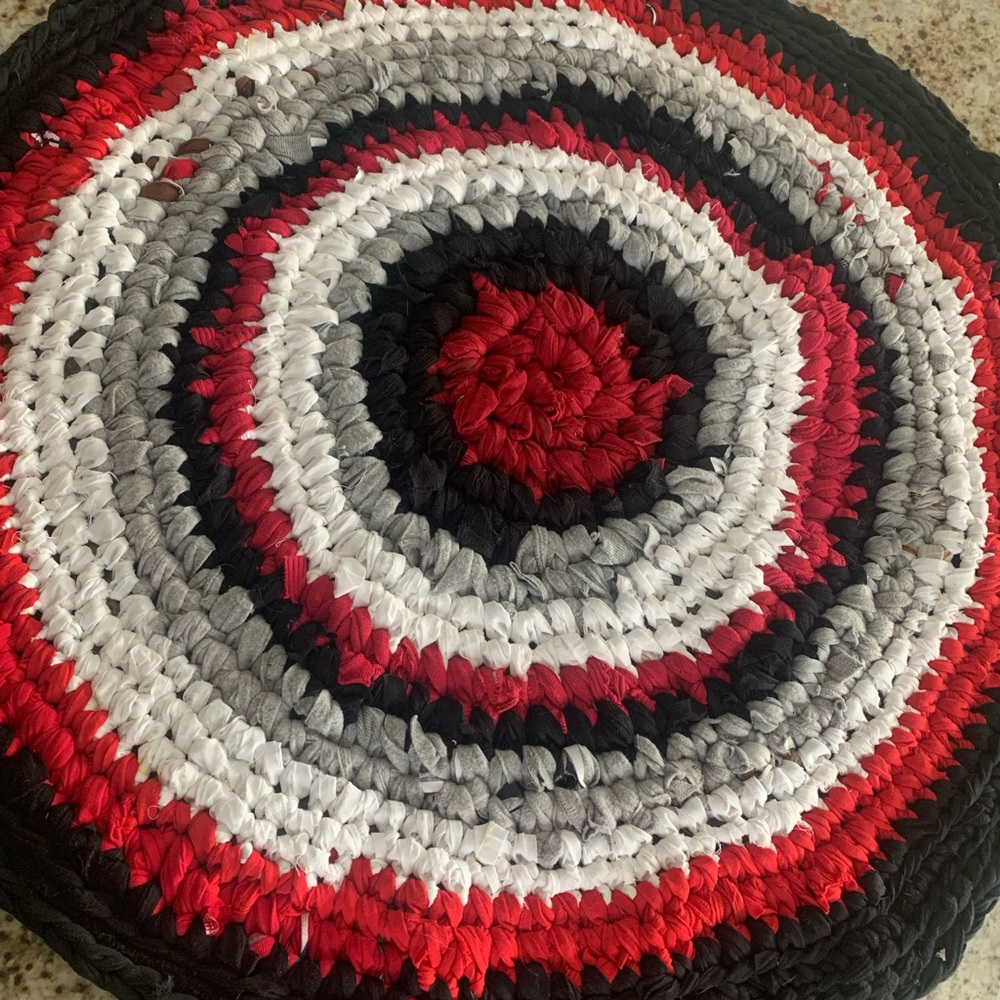 One of a kind, handmade up cycled fabric rug. Perfect for the season.